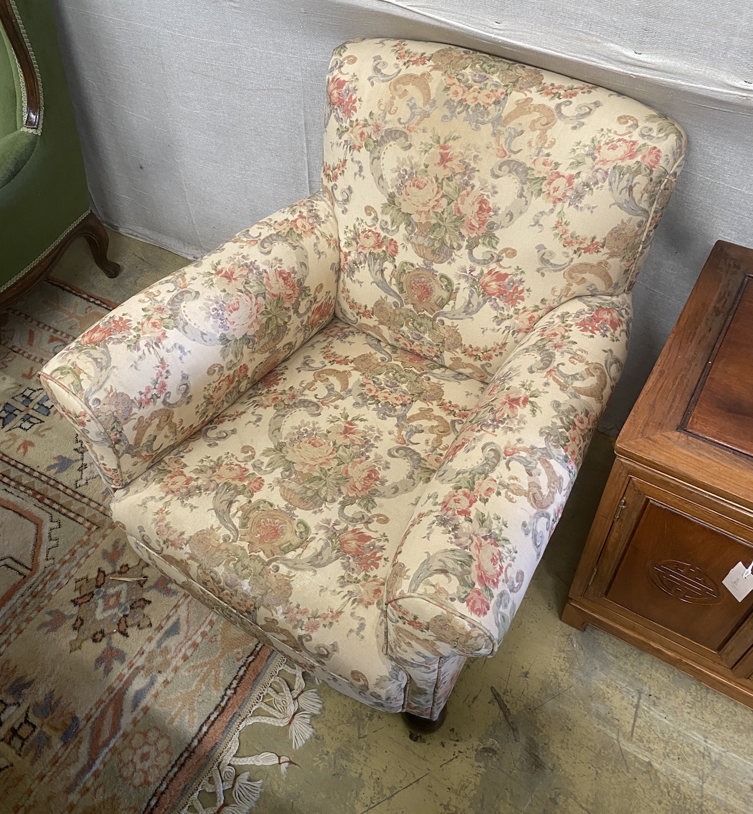 A pair of early 20th century upholstered armchairs, width 82cm, depth 86cm, height 76cm